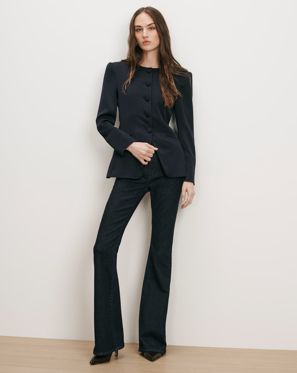 Veronica Beard Navy blazer and dark wash flare jeans.