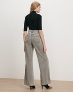 Veronica Beard Black ribbed turtleneck top, gray wide-leg jeans