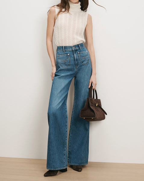 Veronica Beard Blue denim wide-leg jeans with embroidered pockets.