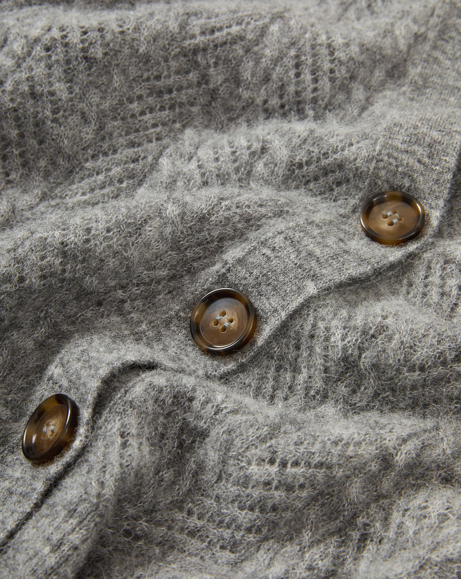Veronica Beard Gray knit cardigan with brown buttons.