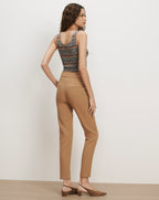 Veronica Beard Brown knit tank top and tan trousers.