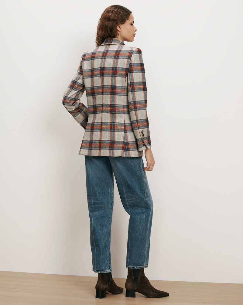 Veronica Beard Plaid blazer with blue jeans and brown boots.