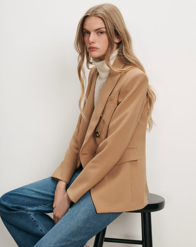 Veronica Beard Tan blazer, white turtleneck, blue jeans
