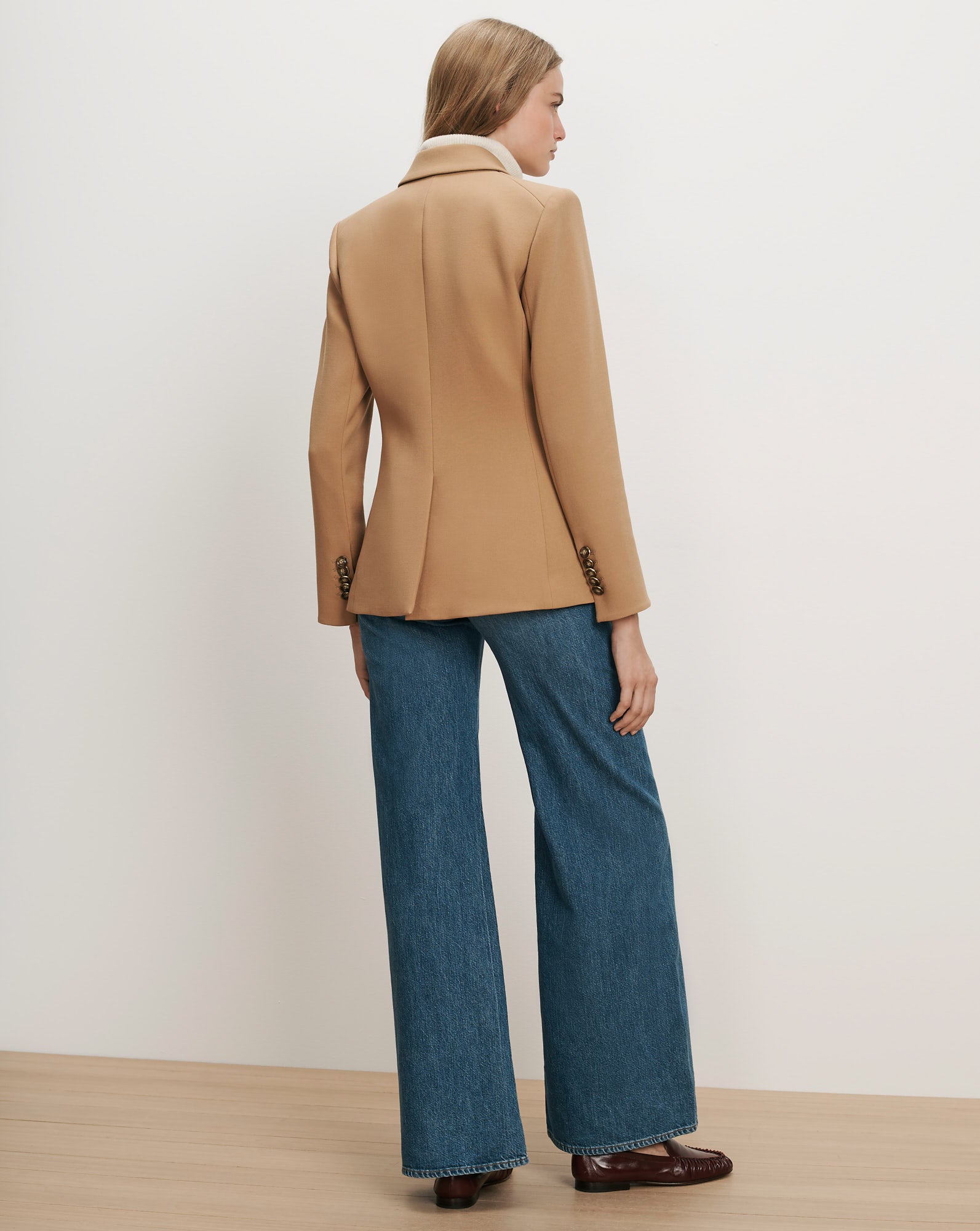 Veronica Beard Camel wool blazer, wide-leg jeans, brown loafers.