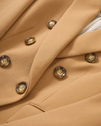 Veronica Beard Tan double-breasted blazer with brown buttons.