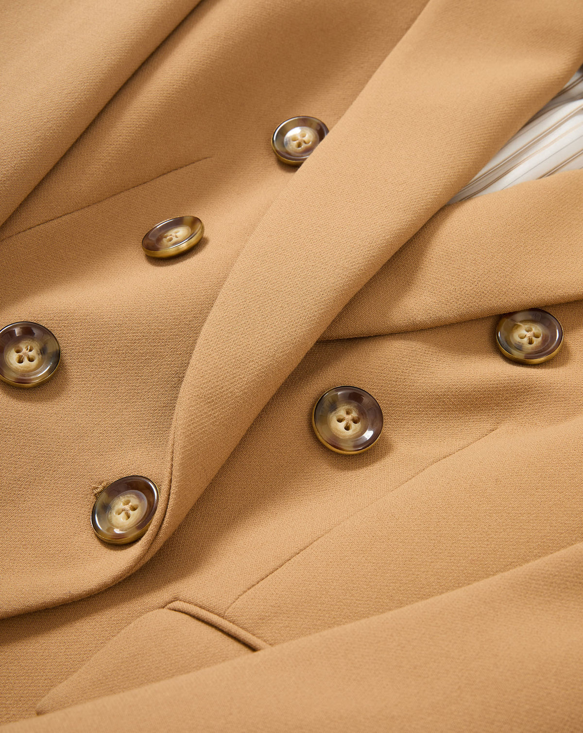 Veronica Beard Tan double-breasted blazer with brown buttons.