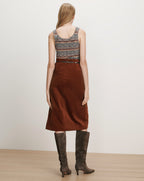 Veronica Beard Brown corduroy midi skirt, belted, with a striped tank top.