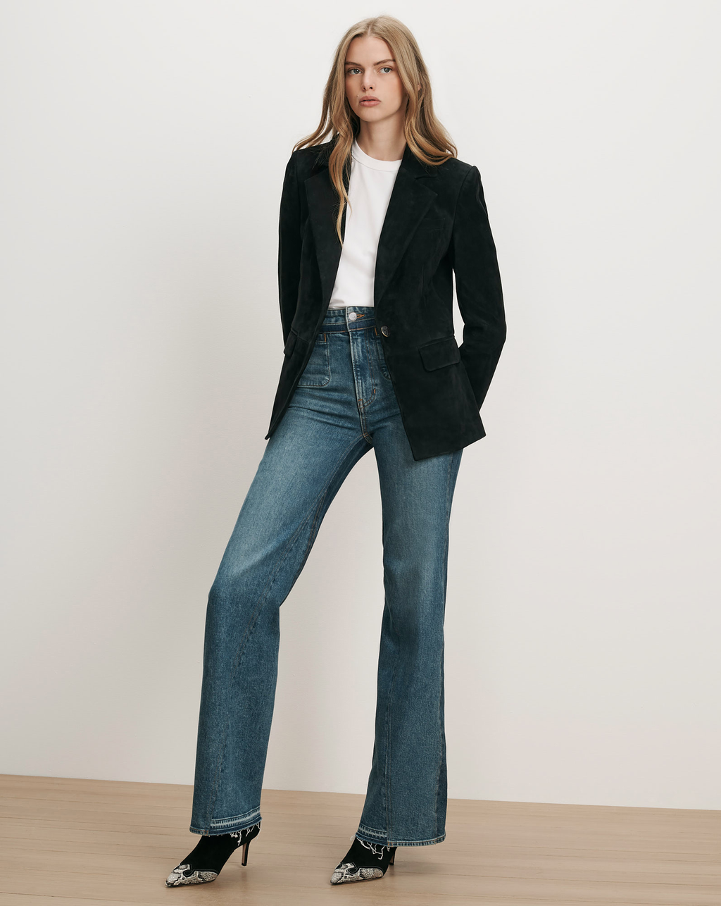 Veronica Beard Black corduroy blazer, white t-shirt, blue flare jeans.