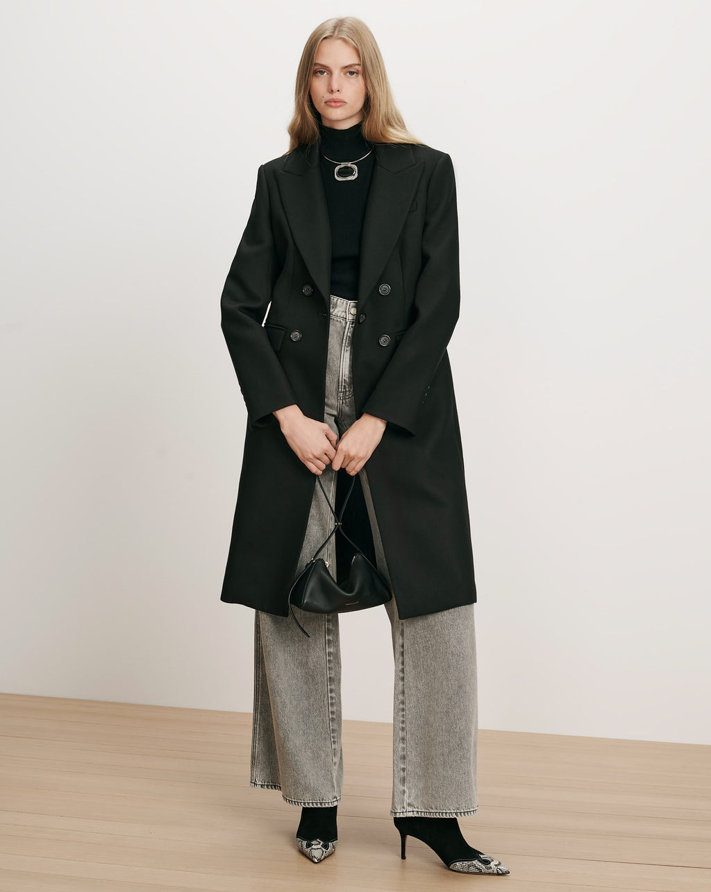 Veronica Beard Black double-breasted wool coat with wide lapels.