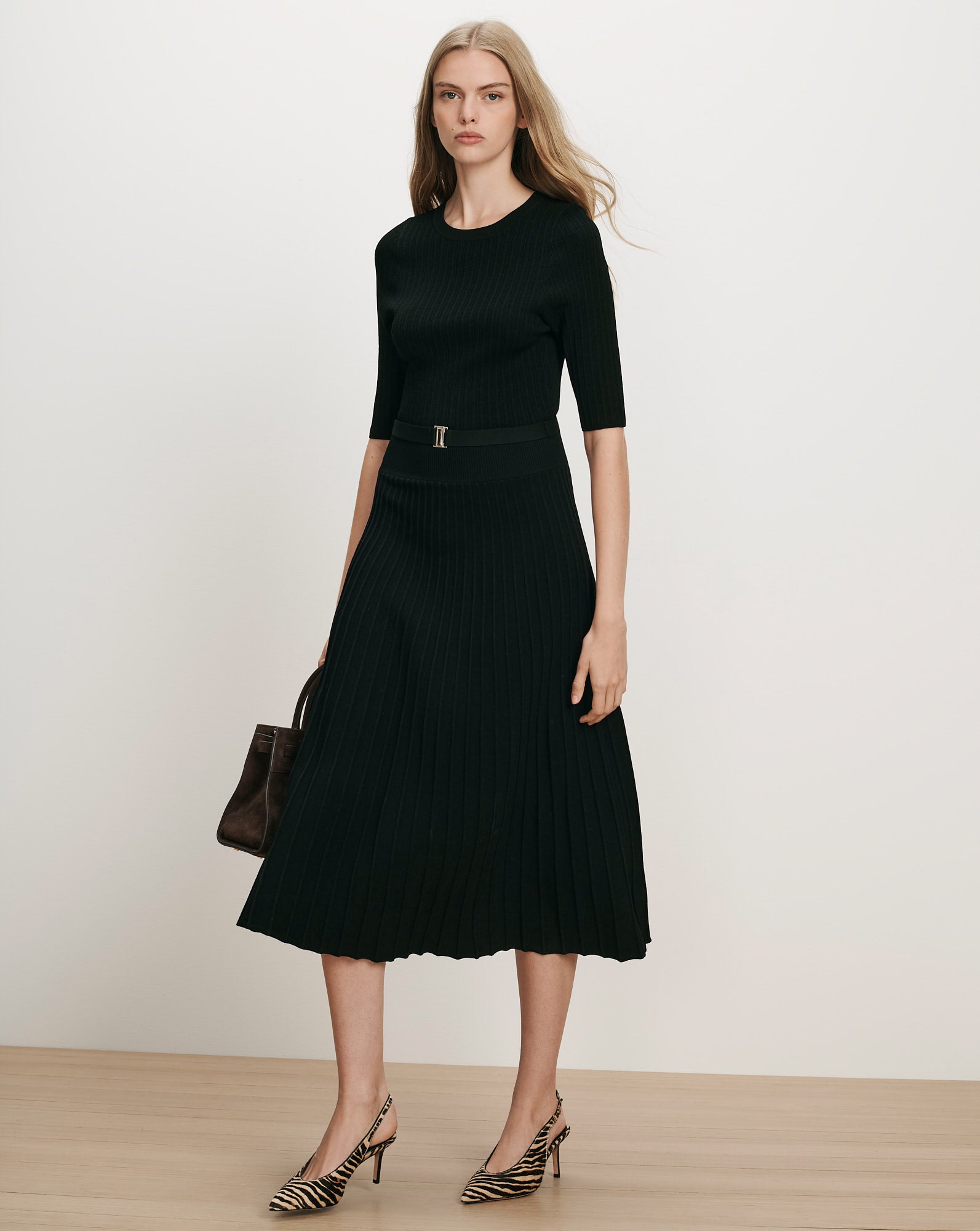 Veronica Beard Black ribbed knit midi dress with pleated skirt.