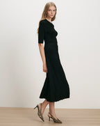 Veronica Beard Black ribbed knit midi dress with pleated skirt.