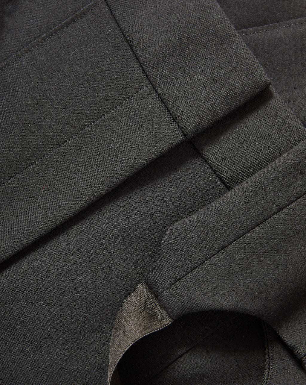 Veronica Beard Black woven fabric with stitched seams.