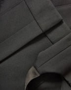 Veronica Beard Black woven fabric with stitched seams.