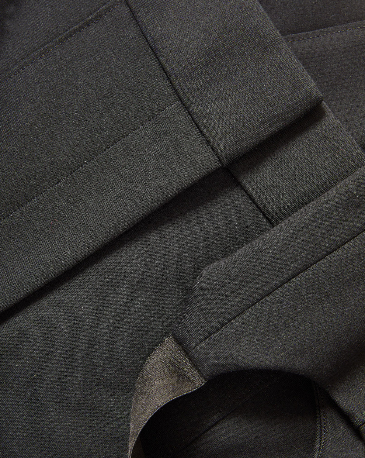 Veronica Beard Black woven fabric with stitched seams.