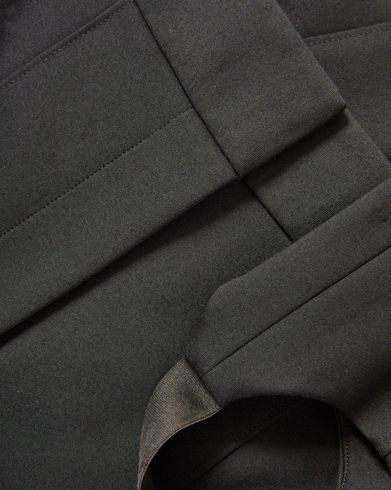 Veronica Beard Black woven fabric with stitched seams.
