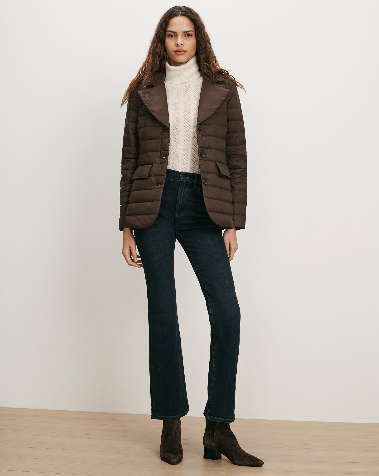 Veronica Beard Brown quilted jacket, cream sweater, dark wash jeans.