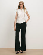 Veronica Beard White satin sleeveless blouse with keyhole neckline.