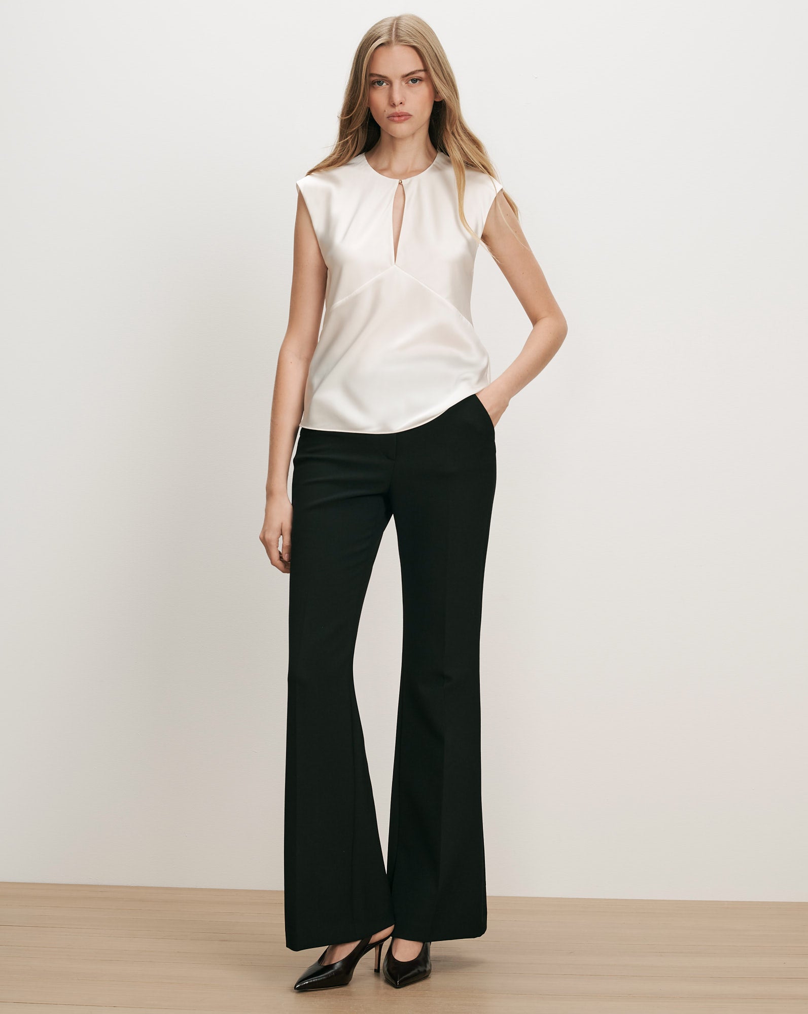 Veronica Beard White satin sleeveless blouse with keyhole neckline.