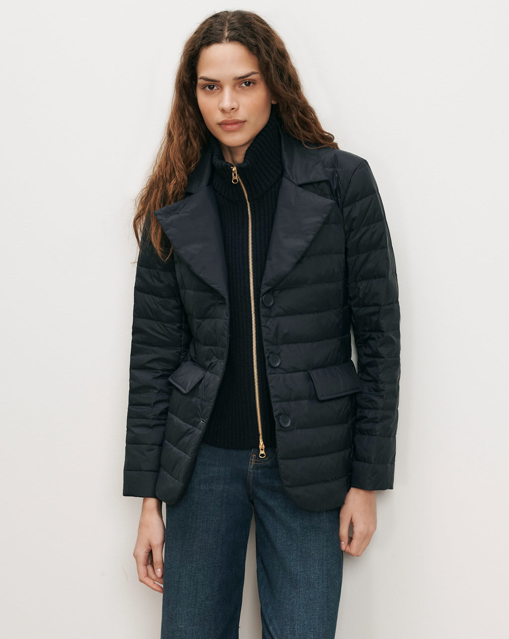 Veronica Beard Black quilted blazer with gold zipper and buttons.