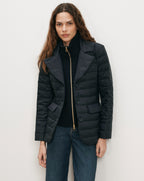 Veronica Beard Black quilted blazer with gold zipper and buttons.