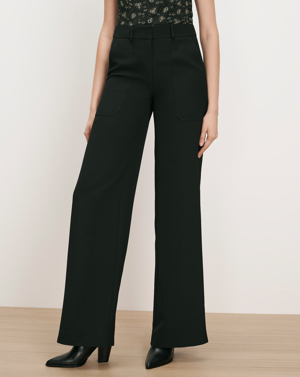 Veronica Beard Black wide-leg trousers with front patch pockets.