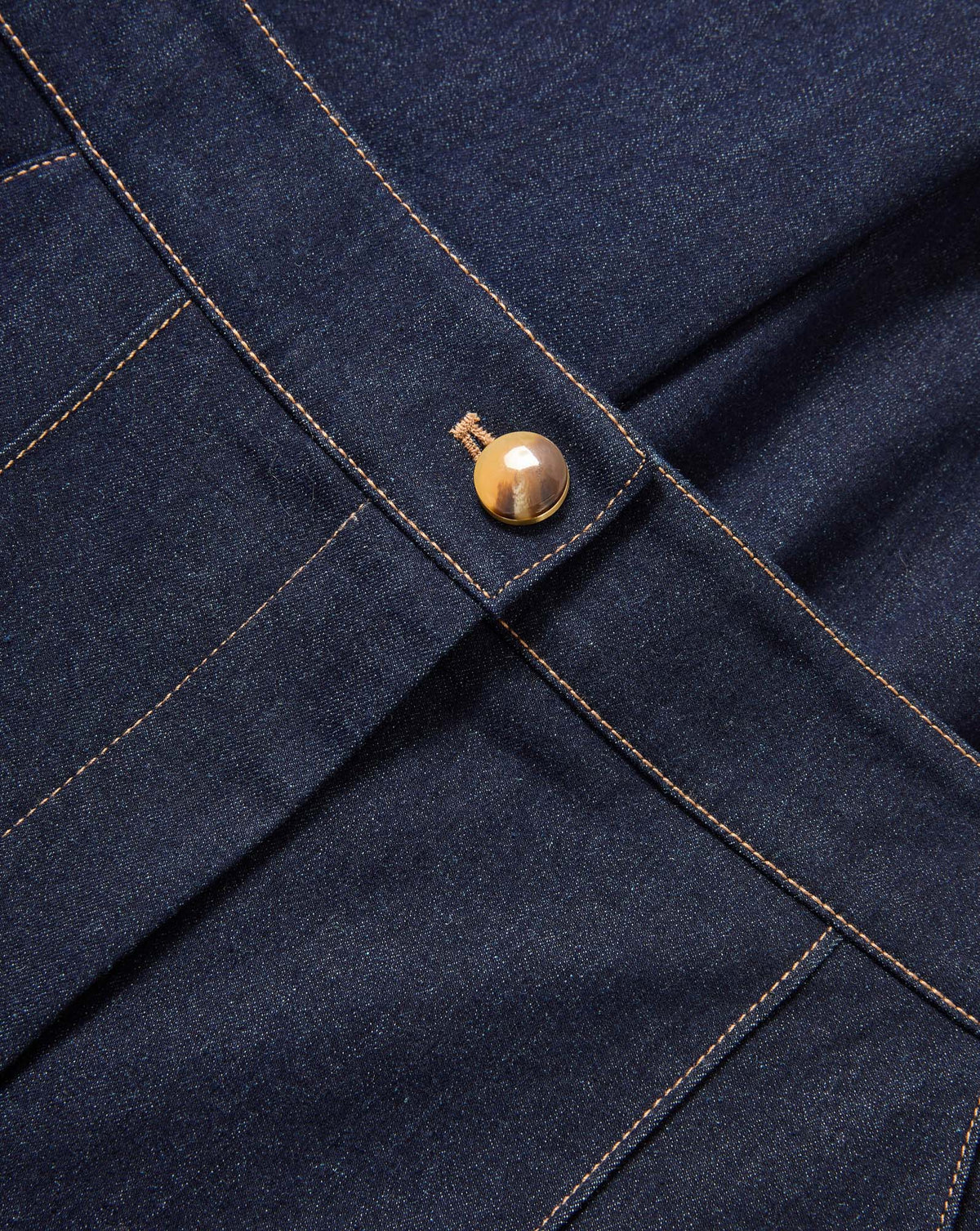 Veronica Beard Dark wash denim skirt with a single gold button.