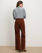 Veronica Beard Brown corduroy wide-leg pants and striped button-up shirt.