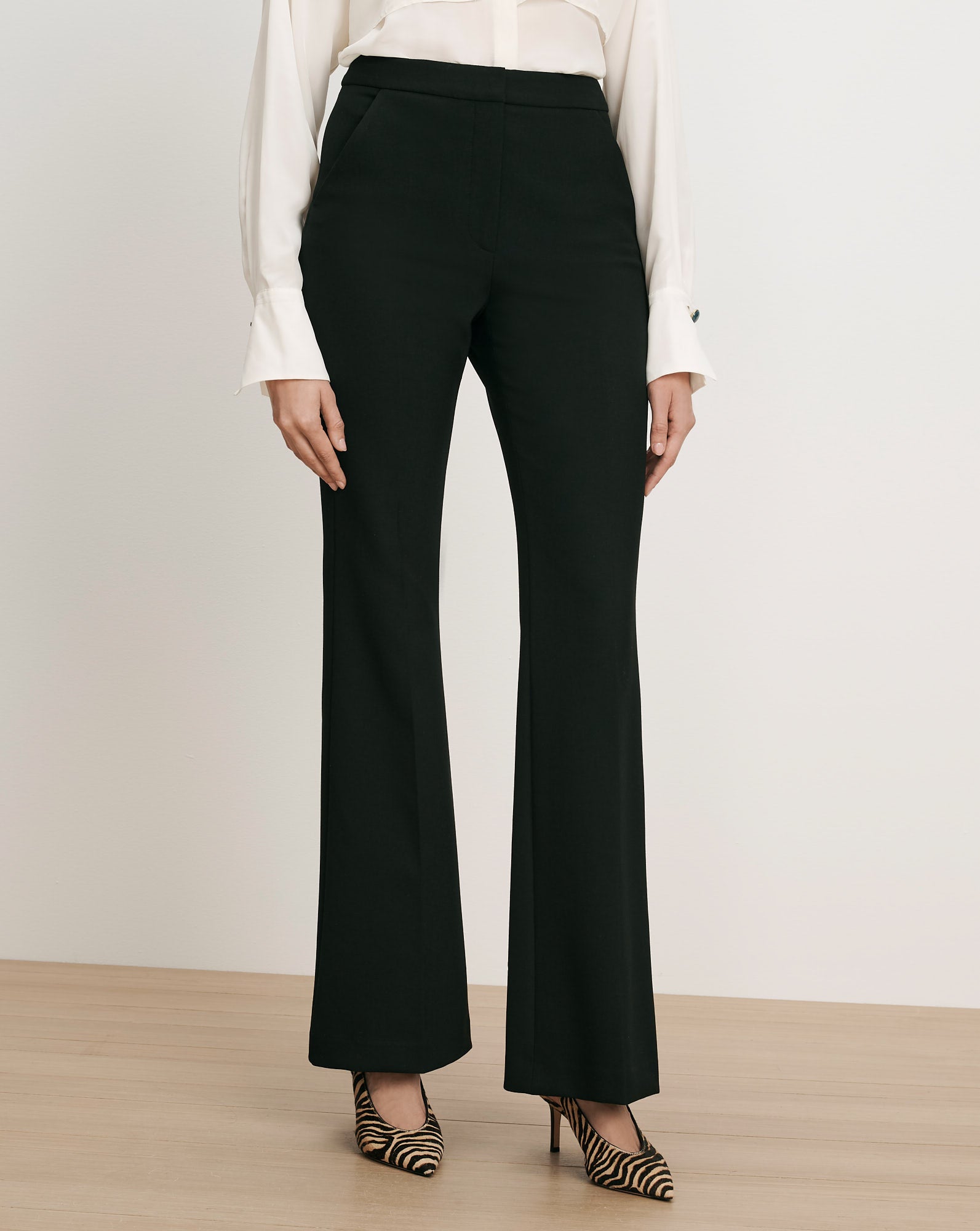 Veronica Beard Black flared trousers with a high waist.