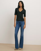 Veronica Beard Black fitted V-neck tee and flare jeans.