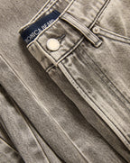 Veronica Beard Washed gray denim jeans with a button closure.