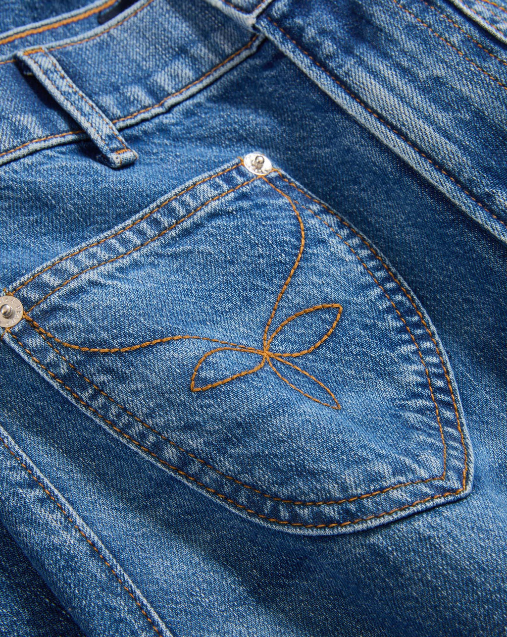 Veronica Beard Blue denim jeans with embroidered back pocket.
