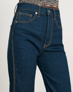 Veronica Beard Blue denim jeans with orange stitching.