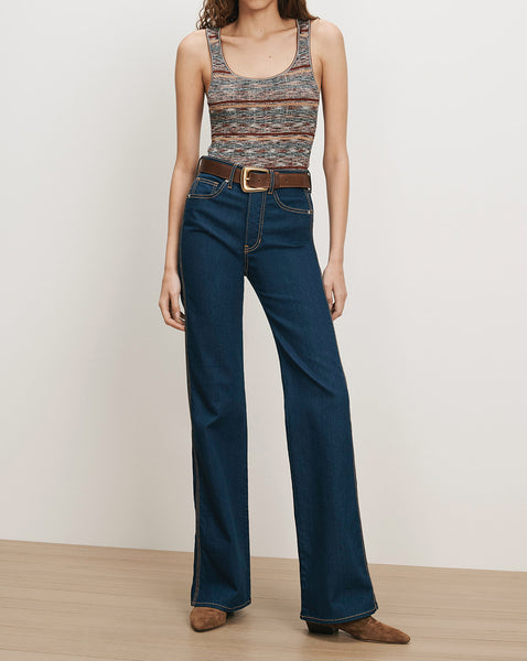 Veronica Beard Dark wash flare jeans, brown belt, striped knit tank.