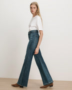Veronica Beard Blue denim flared jeans with white t-shirt.