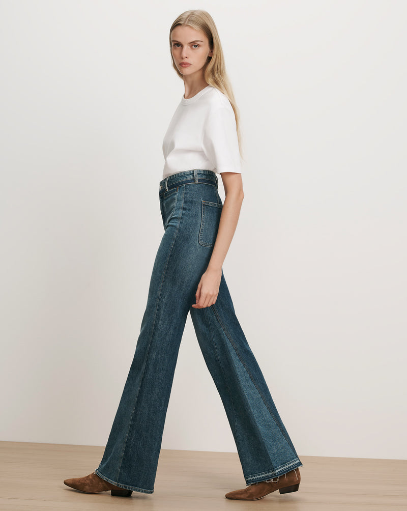 Veronica Beard Blue denim flared jeans with white t-shirt.
