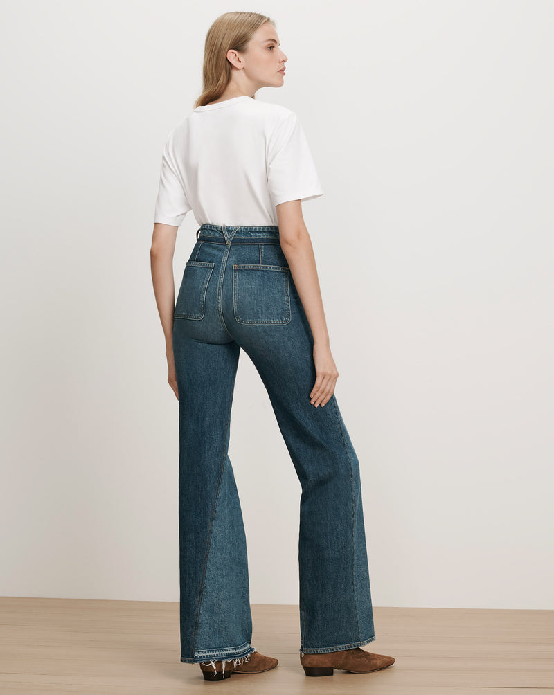 Veronica Beard Blue denim flared jeans with patch pockets.