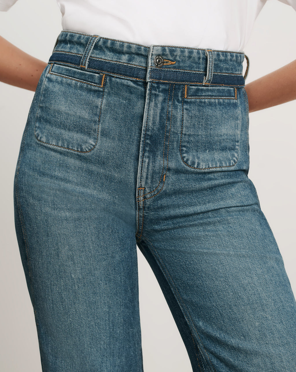 Veronica Beard Blue denim jeans with front patch pockets.