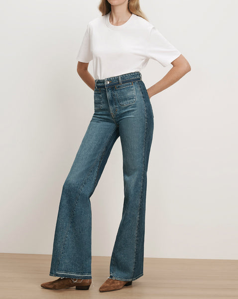 Veronica Beard Blue denim high-waisted flare jeans with front patch pockets.