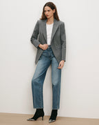 Veronica Beard Gray double-breasted blazer, white t-shirt, blue jeans, black boots.