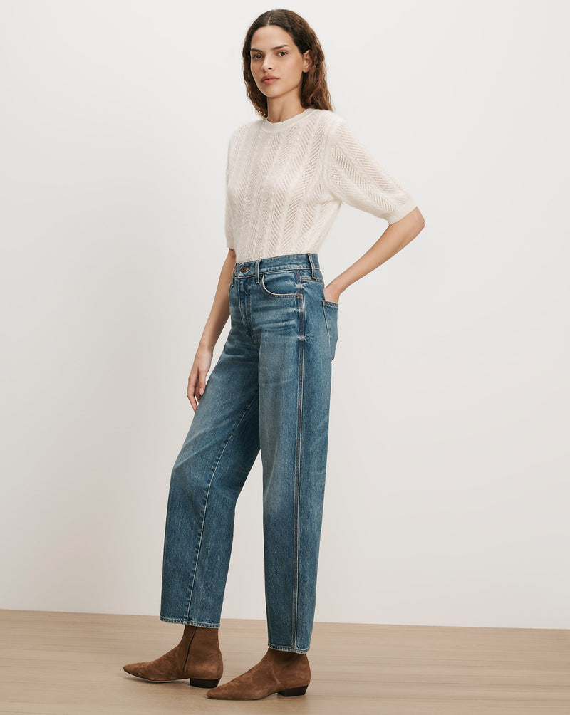 Veronica Beard White knit short-sleeve sweater, blue wide-leg jeans
