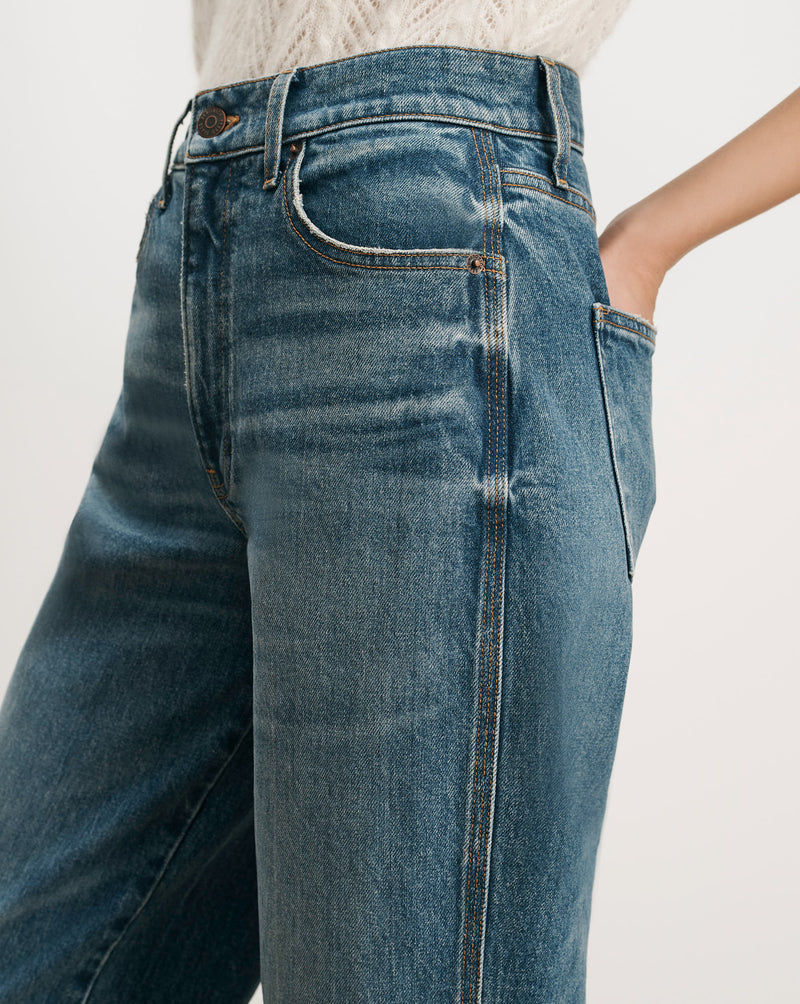 Veronica Beard Blue denim high-waisted jeans with straight leg.