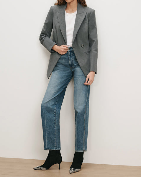 Veronica Beard Gray blazer, white t-shirt, blue jeans, black boots.