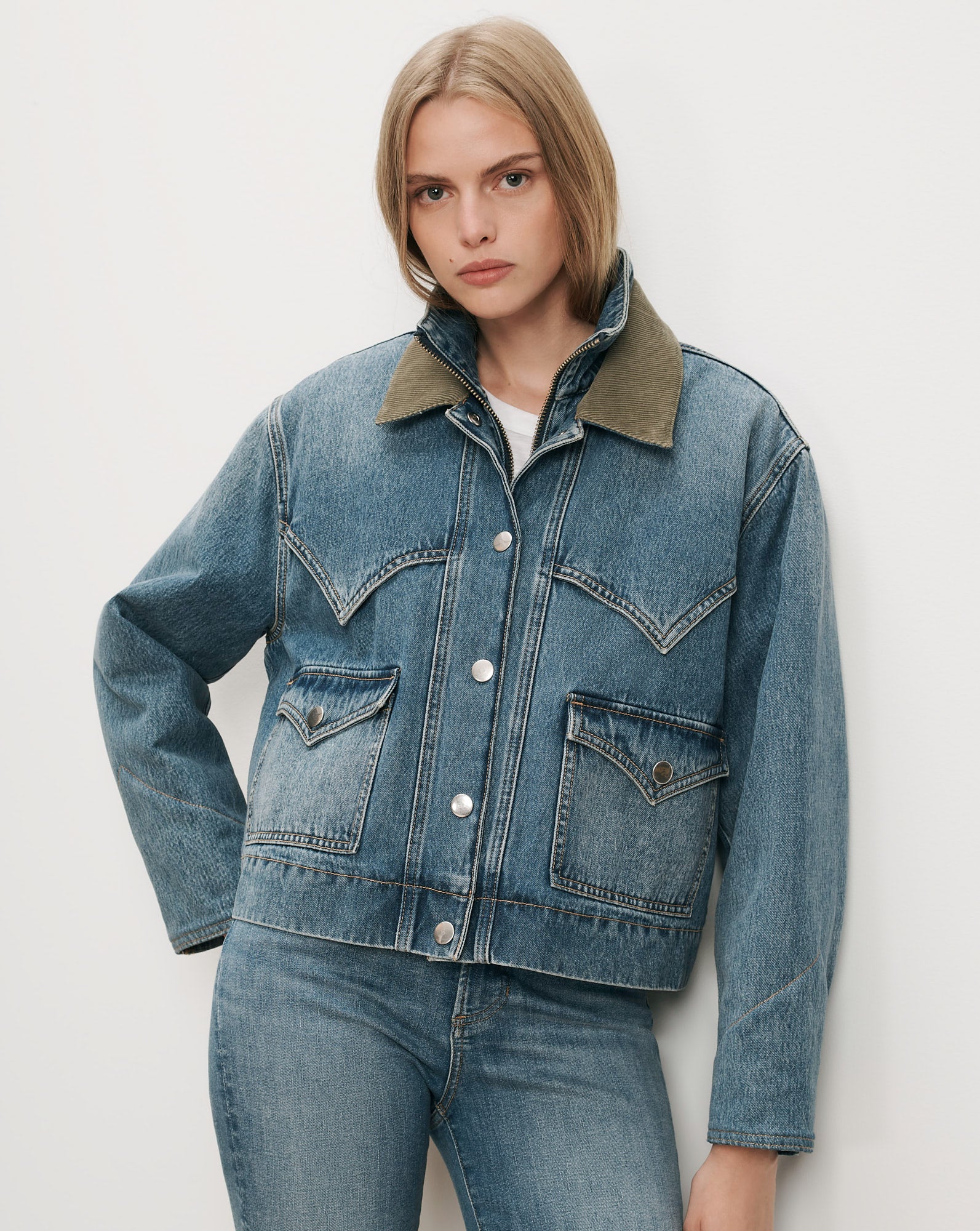 Veronica Beard Blue denim jacket with green corduroy collar.