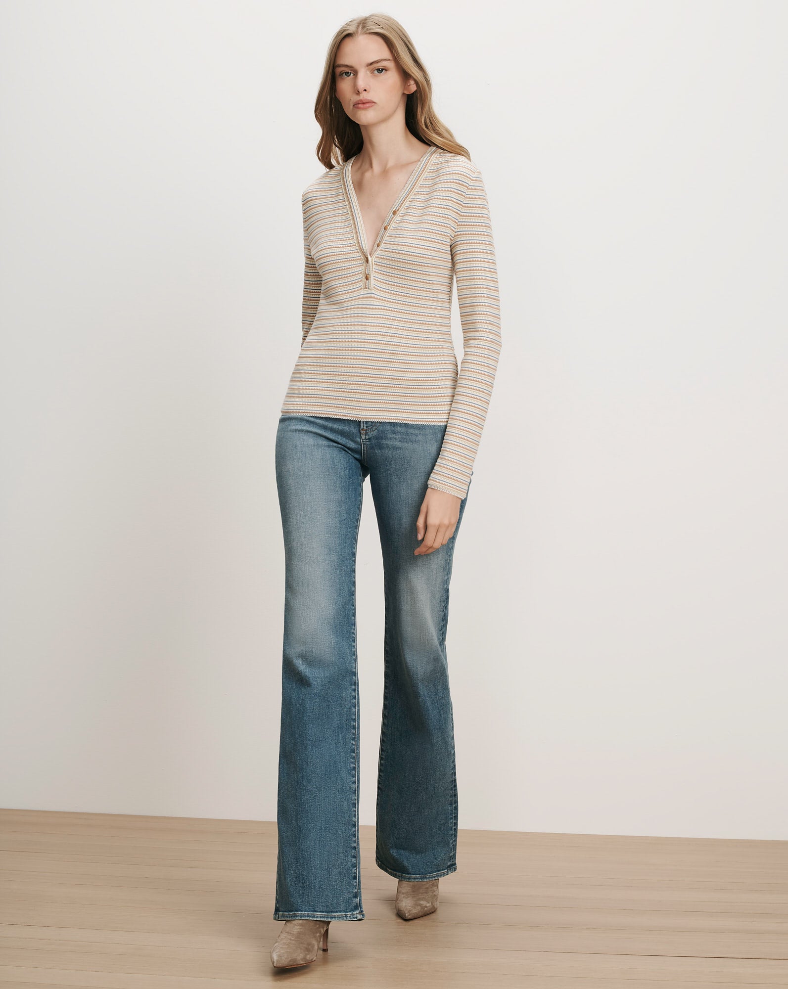 Veronica Beard Striped ribbed long-sleeve top with a partial zipper.