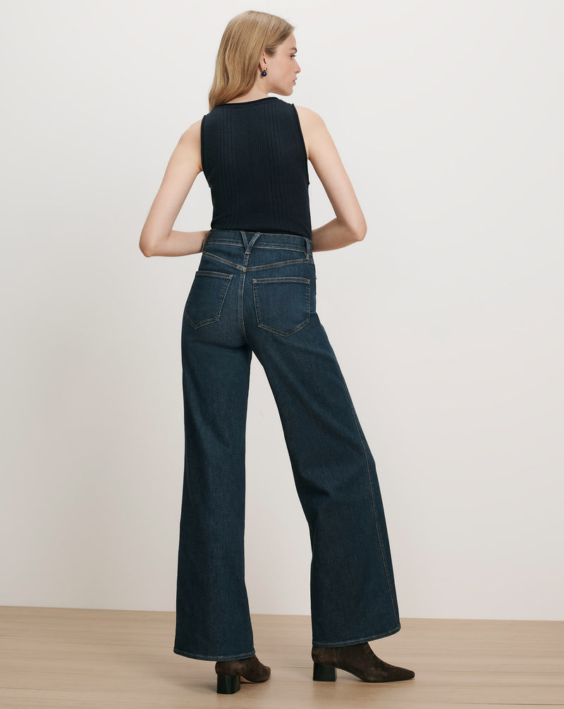 Veronica Beard Dark wash wide-leg jeans and black ribbed tank top.