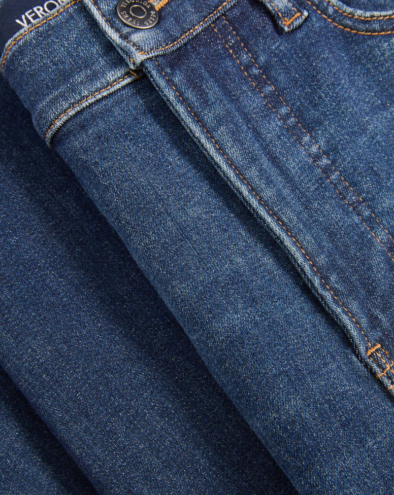 Veronica Beard Blue denim jeans with button and stitching details.