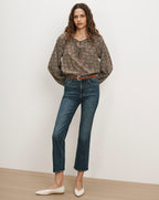 Veronica Beard Brown floral blouse, blue jeans, white flats.