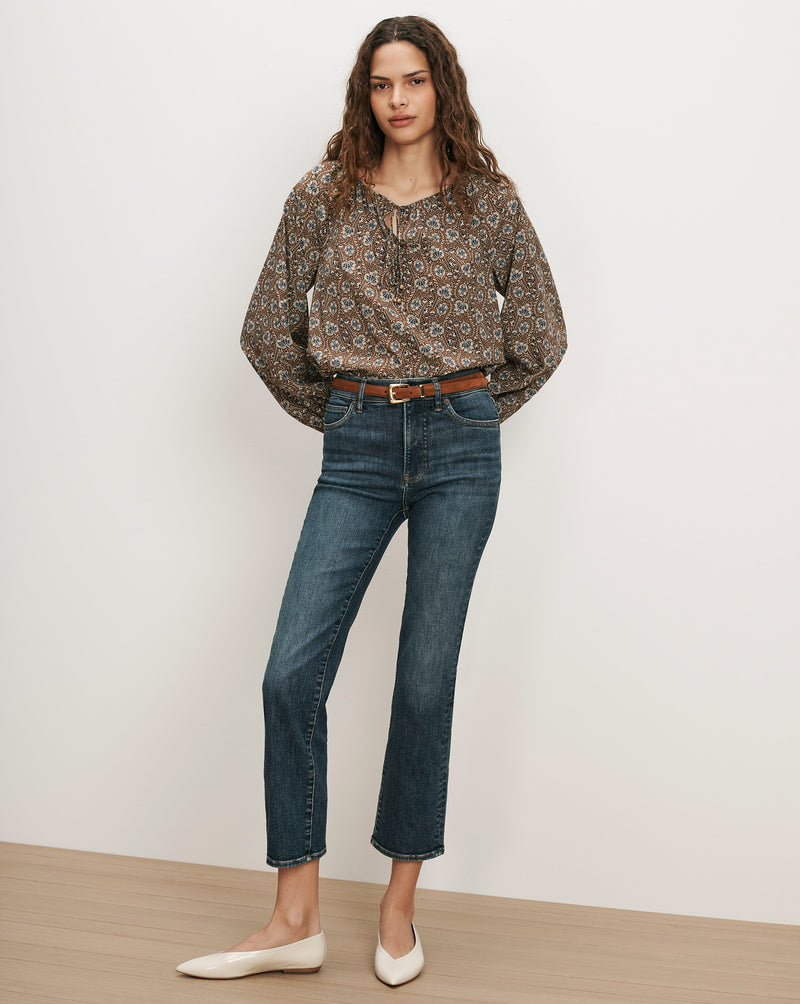 Veronica Beard Brown floral blouse, blue jeans, white flats.