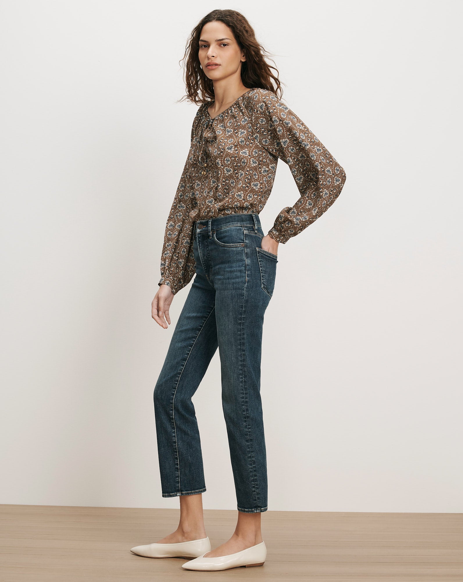Veronica Beard Brown floral blouse, dark wash jeans.