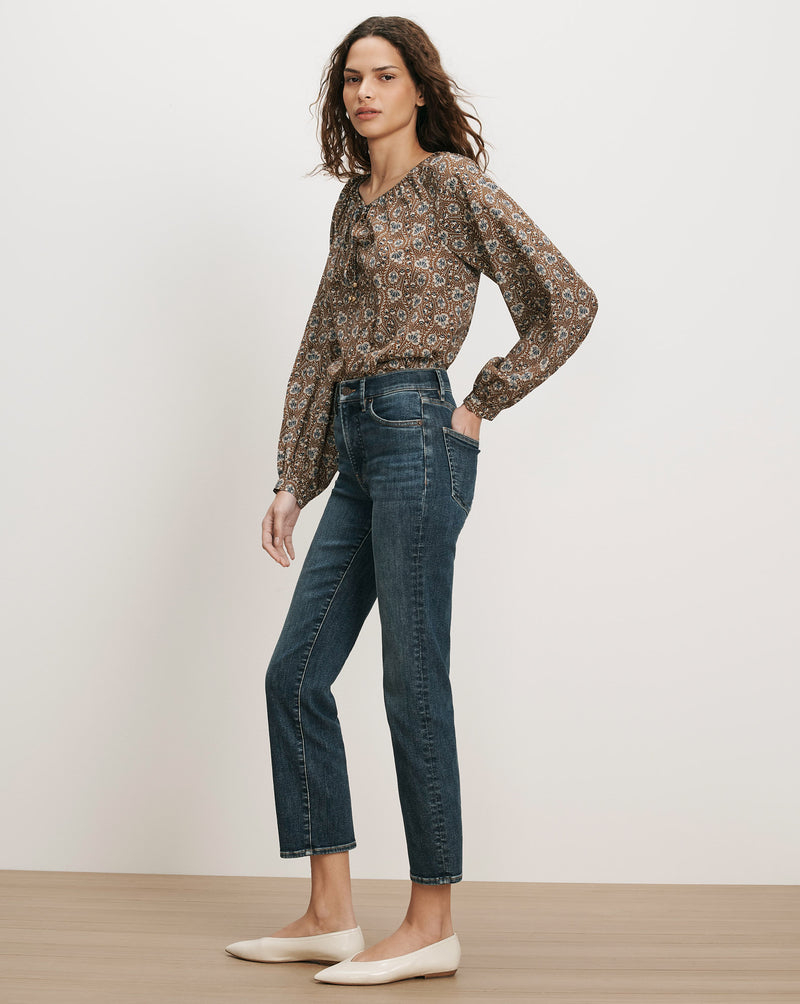 Veronica Beard Brown floral blouse, dark wash jeans.